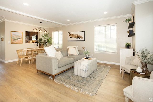 1908 W 1020 N, Provo, UT 84604 - living room with baseboards, light wood-type flooring, ornamental molding, recessed lighting, and a chandelier