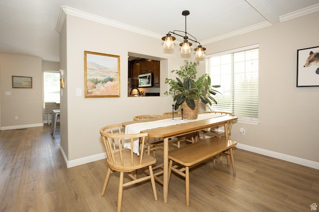1908 W 1020 N, Provo, UT 84604 - dining area with light wood-style flooring, healthy amount of natural light, baseboards, and ornamental molding