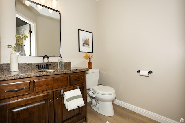 1908 W 1020 N, Provo, UT 84604 - bathroom featuring toilet, baseboards, vanity, and wood finished floors