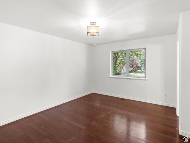 1206 W 3300 N, Pleasant Grove, UT 84062 - empty room with dark wood-style flooring and baseboards