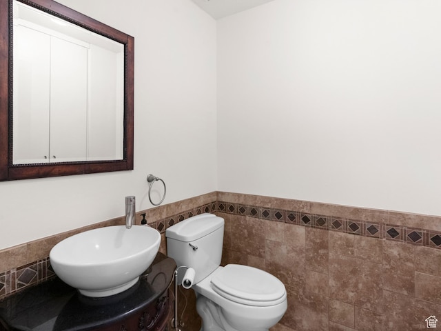 1206 W 3300 N, Pleasant Grove, UT 84062 - bathroom featuring tile walls, a wainscoted wall, and toilet