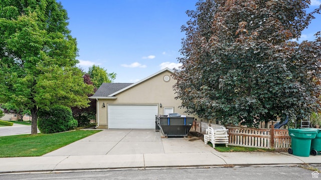 10205 N 3900 W, Cedar Hills, UT 84062 - view of front facade featuring stucco siding, concrete driveway, and a garage