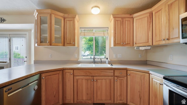 10205 N 3900 W, Cedar Hills, UT 84062 - kitchen with stainless steel appliances, a sink, light countertops, and glass insert cabinets