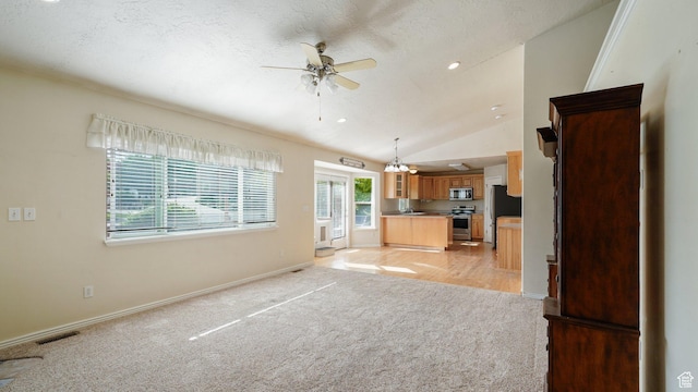 10205 N 3900 W, Cedar Hills, UT 84062 - unfurnished living room with a ceiling fan, light colored carpet, baseboards, and vaulted ceiling
