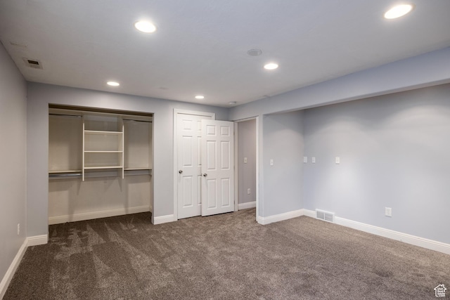 3421 E Dundee Dr, Eagle Mountain, UT 84005 - unfurnished bedroom featuring dark carpet, recessed lighting, baseboards, and multiple closets