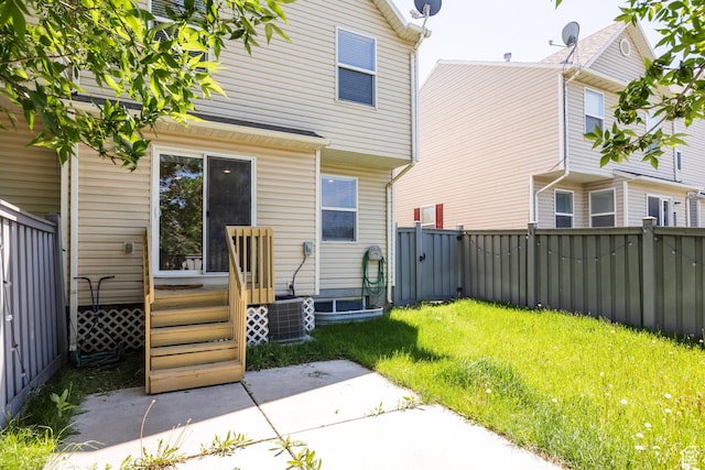 3421 E Dundee Dr, Eagle Mountain, UT 84005 - back of property with a wooden deck and central AC