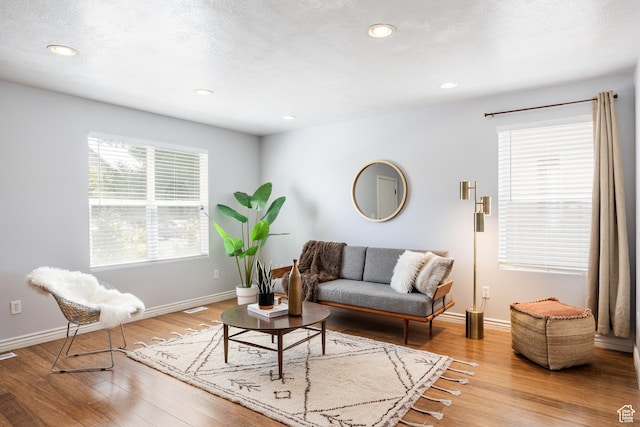 3421 E Dundee Dr, Eagle Mountain, UT 84005 - living area featuring wood finished floors, baseboards, and recessed lighting