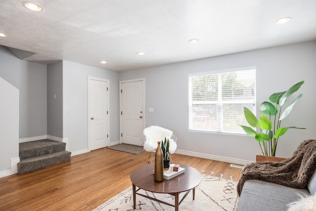 3421 E Dundee Dr, Eagle Mountain, UT 84005 - sitting room with baseboards, light wood-style floors, and recessed lighting