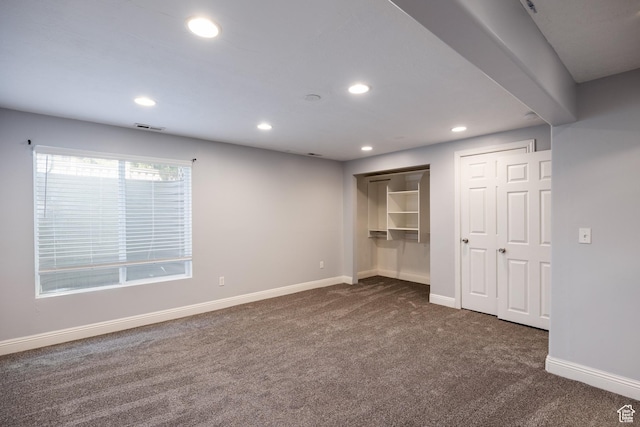 3421 E Dundee Dr, Eagle Mountain, UT 84005 - unfurnished bedroom with dark colored carpet, baseboards, recessed lighting, and two closets