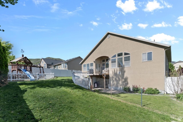 14163 S Friendship Dr W, Herriman, UT 84065 - rear view of property featuring a playground, a residential view, and stucco siding