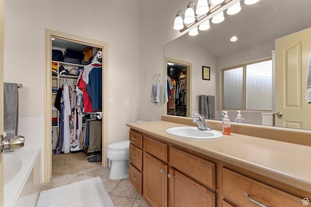 14163 S Friendship Dr W, Herriman, UT 84065 - full bathroom with a walk in closet, vanity, a garden tub, toilet, and tile patterned flooring