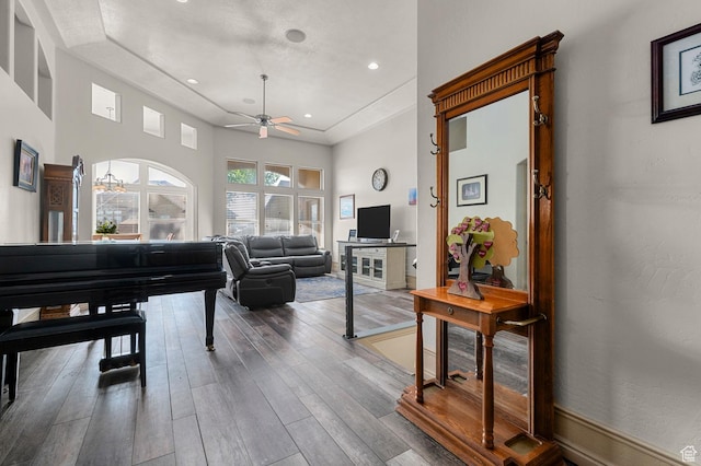 14163 S Friendship Dr W, Herriman, UT 84065 - living room featuring ceiling fan, wood finished floors, and a tray ceiling