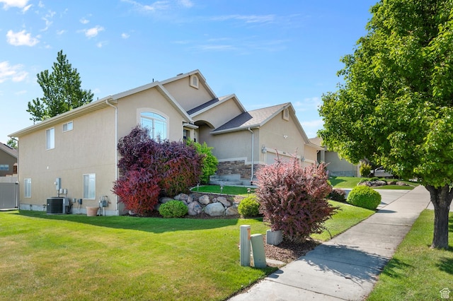 14163 S Friendship Dr W, Herriman, UT 84065 - view of property exterior featuring cooling unit, stucco siding, and a lawn