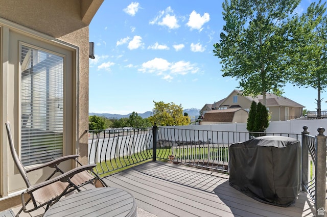 14163 S Friendship Dr W, Herriman, UT 84065 - wooden deck with a mountain view, a fenced backyard, and area for grilling