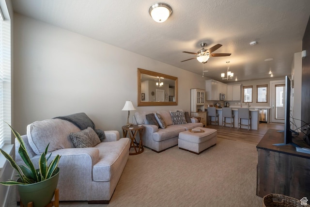 898 S 2560 E, Spanish Fork, UT 84660 - living room featuring a ceiling fan, a chandelier, and light wood-style floors
