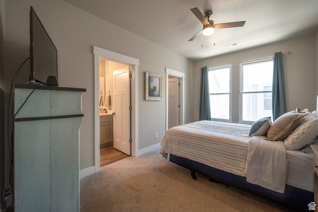 898 S 2560 E, Spanish Fork, UT 84660 - bedroom featuring light colored carpet, baseboards, ensuite bathroom, and ceiling fan
