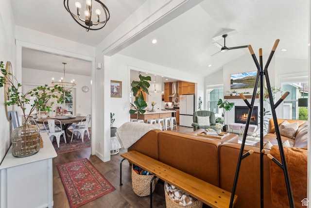 222 S Summer Breeze Ln, Layton, UT 84041 - living area featuring a chandelier, a warm lit fireplace, lofted ceiling, dark wood-style floors, and a ceiling fan