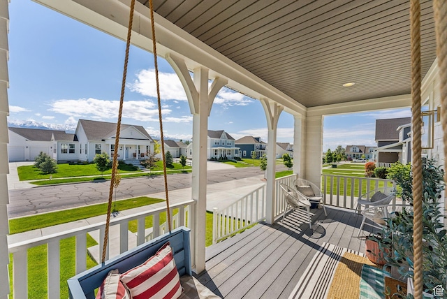 222 S Summer Breeze Ln, Layton, UT 84041 - porch with a residential view and a lawn