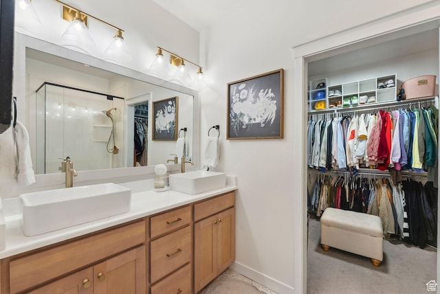 222 S Summer Breeze Ln, Layton, UT 84041 - full bathroom featuring double vanity, a walk in closet, a shower stall, and baseboards