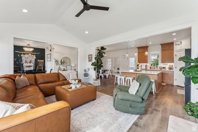 222 S Summer Breeze Ln, Layton, UT 84041 - living room featuring vaulted ceiling, a ceiling fan, a chandelier, wood finished floors, and recessed lighting
