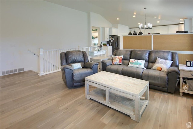 958 W Regatta Ln, Stansbury Park, UT 84074 - living area with a chandelier, vaulted ceiling, light wood finished floors, and recessed lighting