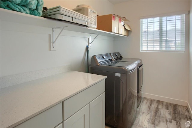 958 W Regatta Ln, Stansbury Park, UT 84074 - washroom with washer and dryer, light wood finished floors, and baseboards