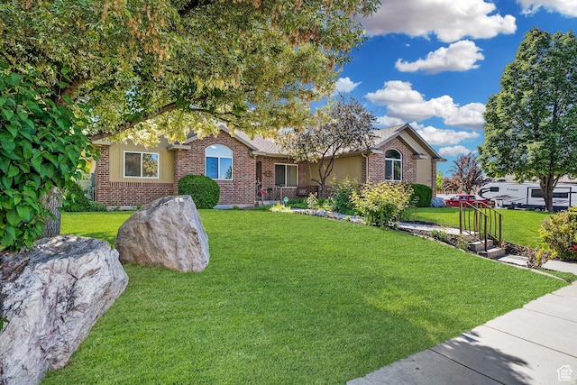 3285 S 575 W, Syracuse, UT 84075 - ranch-style home featuring brick siding and a front yard