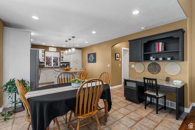 3285 S 575 W, Syracuse, UT 84075 - dining space with arched walkways, baseboards, recessed lighting, and a chandelier