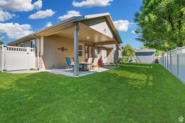 3285 S 575 W, Syracuse, UT 84075 - back of house with stucco siding, a patio, and an outdoor structure
