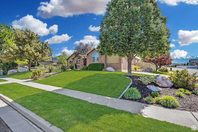 3285 S 575 W, Syracuse, UT 84075 - view of front of home with brick siding and a front yard