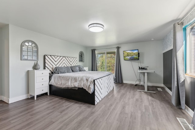 3407 S 325 W, Bountiful, UT 84010 - bedroom featuring wood finished floors, multiple windows, and baseboards