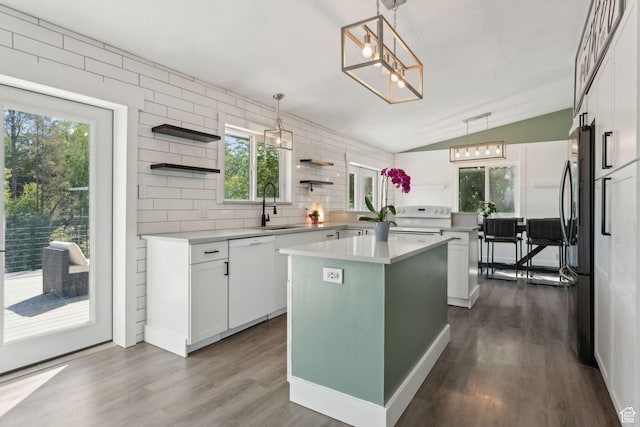 3407 S 325 W, Bountiful, UT 84010 - kitchen featuring a sink, open shelves, white appliances, vaulted ceiling, and a center island