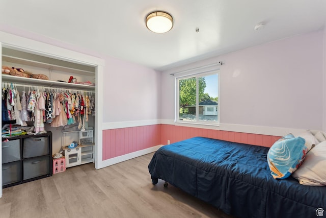 3407 S 325 W, Bountiful, UT 84010 - bedroom featuring wainscoting, wood finished floors, and a closet