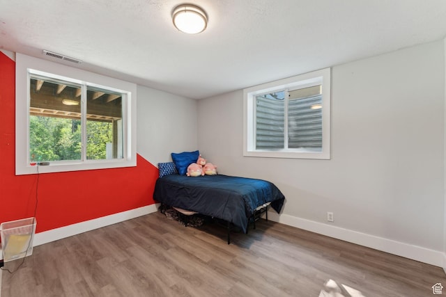 3407 S 325 W, Bountiful, UT 84010 - bedroom featuring wood finished floors and baseboards