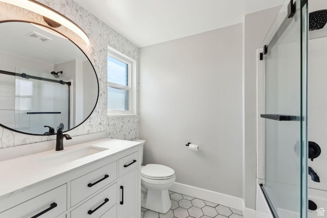 3407 S 325 W, Bountiful, UT 84010 - bathroom featuring vanity, toilet, tile patterned floors, combined bath / shower with glass door, and baseboards