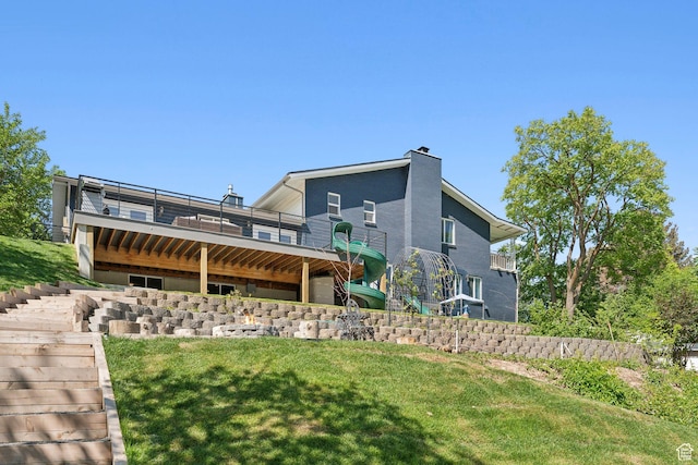 3407 S 325 W, Bountiful, UT 84010 - rear view of property featuring a yard, a chimney, stairs, and a wooden deck