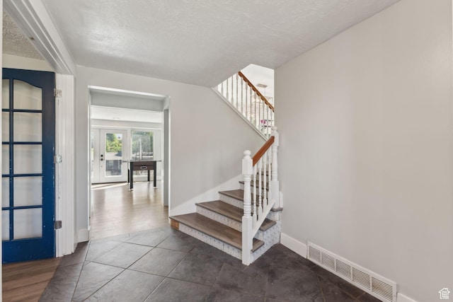 3407 S 325 W, Bountiful, UT 84010 - stairway featuring a textured ceiling and baseboards