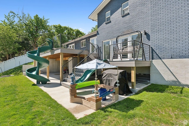 3407 S 325 W, Bountiful, UT 84010 - back of property with stairs, brick siding, and a wooden deck
