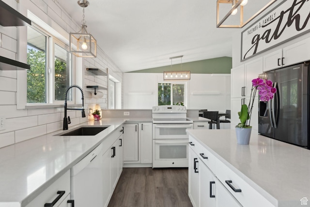 3407 S 325 W, Bountiful, UT 84010 - kitchen featuring white appliances, a sink, vaulted ceiling, plenty of natural light, and light countertops