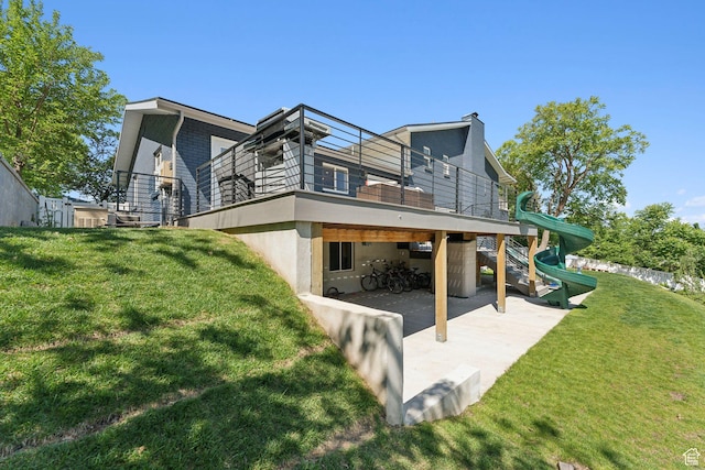 3407 S 325 W, Bountiful, UT 84010 - back of house featuring a playground, a patio, a lawn, stucco siding, and a chimney