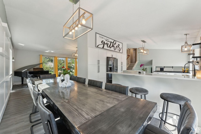 3407 S 325 W, Bountiful, UT 84010 - dining area with stairs, a chandelier, and dark wood-style flooring