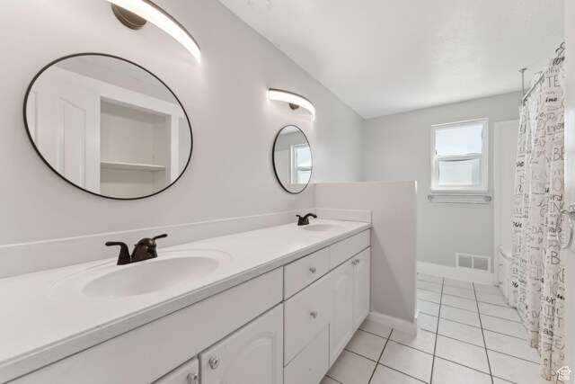3407 S 325 W, Bountiful, UT 84010 - bathroom featuring double vanity, tile patterned floors, and baseboards