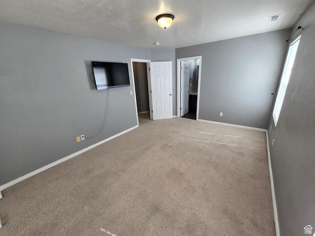 4043 S Lake Vista Dr, Saratoga Springs, UT 84045 - unfurnished bedroom with baseboards, carpet floors, and connected bathroom