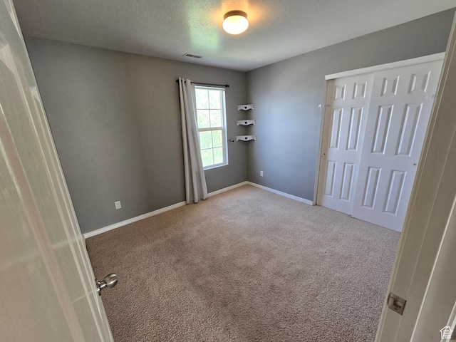 4043 S Lake Vista Dr, Saratoga Springs, UT 84045 - unfurnished bedroom with carpet floors, baseboards, and a closet