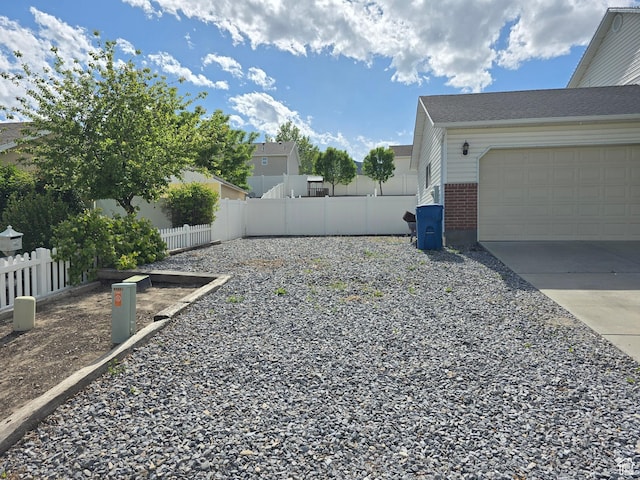 4043 S Lake Vista Dr, Saratoga Springs, UT 84045 - view of yard featuring concrete driveway and a garage