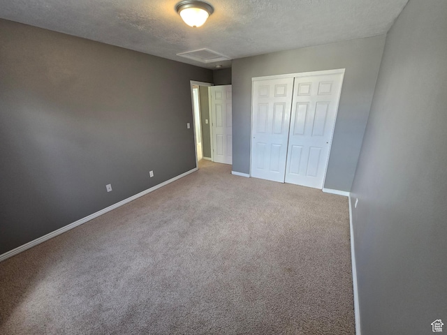 4043 S Lake Vista Dr, Saratoga Springs, UT 84045 - unfurnished bedroom featuring a textured ceiling, carpet floors, baseboards, a closet, and attic access