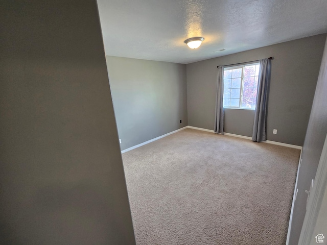 4043 S Lake Vista Dr, Saratoga Springs, UT 84045 - spare room with baseboards, carpet flooring, and a textured ceiling