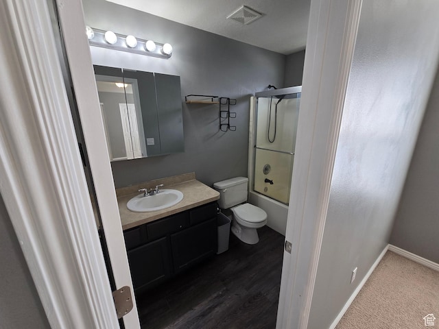 4043 S Lake Vista Dr, Saratoga Springs, UT 84045 - bathroom featuring toilet, vanity, and bath / shower combo with glass door