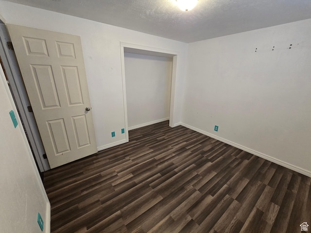 4043 S Lake Vista Dr, Saratoga Springs, UT 84045 - unfurnished bedroom with dark wood finished floors, a closet, and baseboards