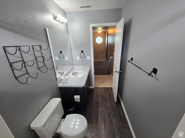 4043 S Lake Vista Dr, Saratoga Springs, UT 84045 - half bathroom featuring wood finished floors, vanity, toilet, and baseboards